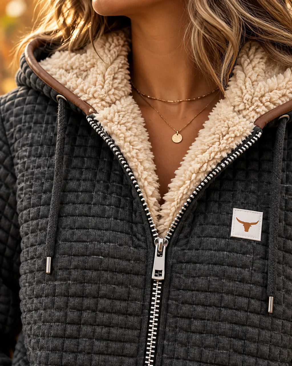 Sandra | Giacca trapuntata con zip e cappuccio foderata in sherpa